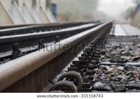 Railway track on steel bridge -shallow depth of field Royalty-Free Stock Photo #331158743