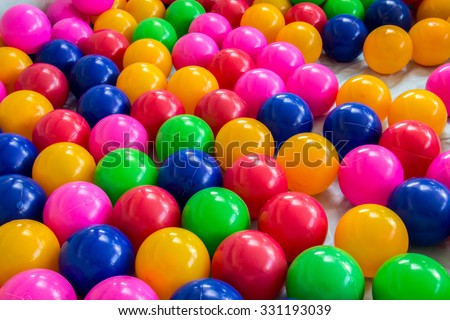 colorful ball, children's party, a games room, a box filled with small colored balls
