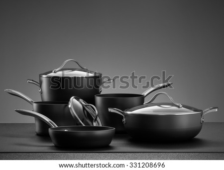 close up view of nice cookware set on grey color back Royalty-Free Stock Photo #331208696