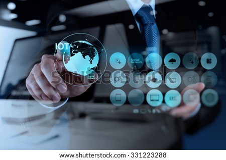 double exposure of hand showing Internet of things (IoT) word diagram as concept Royalty-Free Stock Photo #331223288