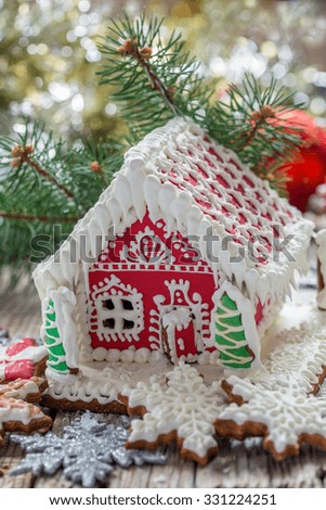 Beautiful Christmas gingerbread house on a wooden table.