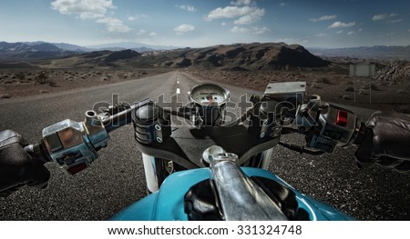 Man driving on moto on big speed on mountain road