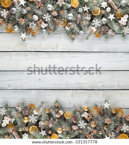 Christmas fir tree with decoration on a wooden board. Copy-space for text