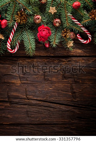 Christmas fir tree with decoration on a wooden board. Copy-space for text