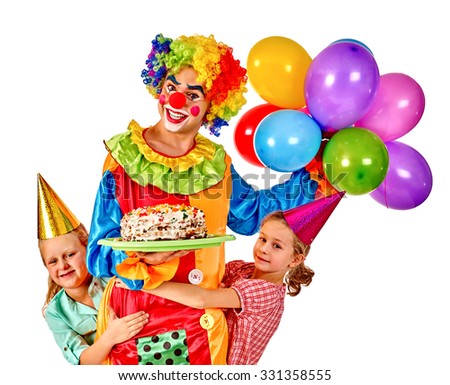 Clown with baloon holding cake on birthday group children. Isolated.