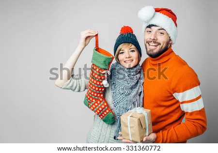 Beautiful couple celebrating Christmas and New Year.