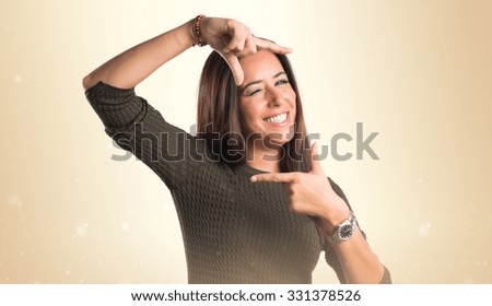 woman focusing with her fingers 