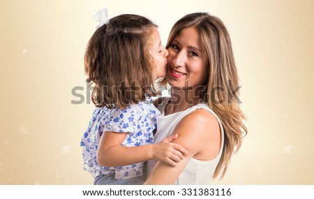 daughter kissing her mother