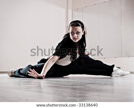 hip-hop girl in dance motion. photo in dance studio