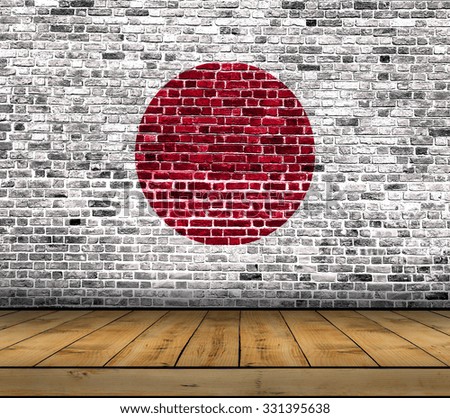 Japan flag painted on brick wall with wooden floor