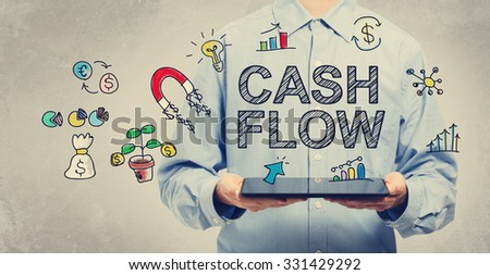 Cash Flow concept with young man holding a tablet computer 