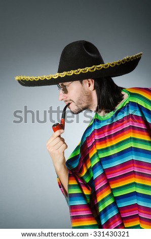Mexican smoking pipe wearing sombrero