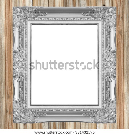 Antique gray frame on wooden wall background