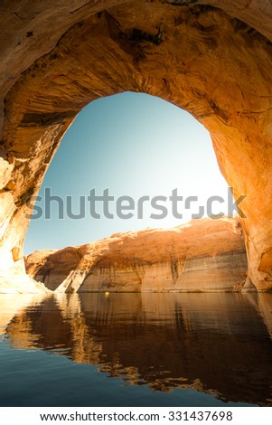Lost Eden Canyon Lake Powell Utah with kayaker in the background