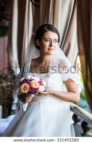 Cute bride in luxury interior. Wedding concept.