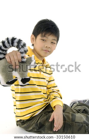 Photo of Asian kid with lemur toy