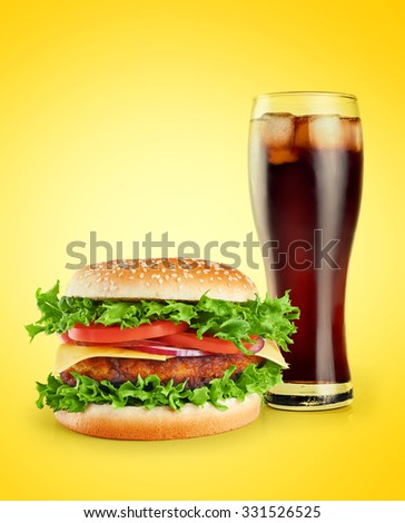 Hamburger and cola on a yellow background.