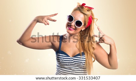 Pin-up girl doing victory gesture