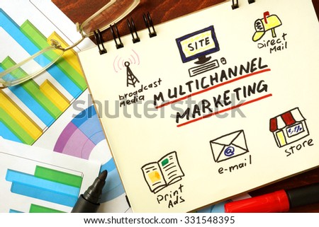 Notepad with multi channel marketing  concept. Royalty-Free Stock Photo #331548395