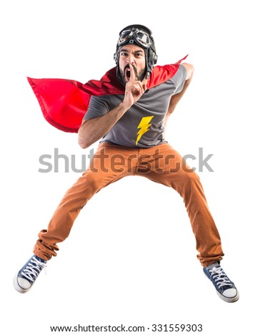 Superhero making silence gesture