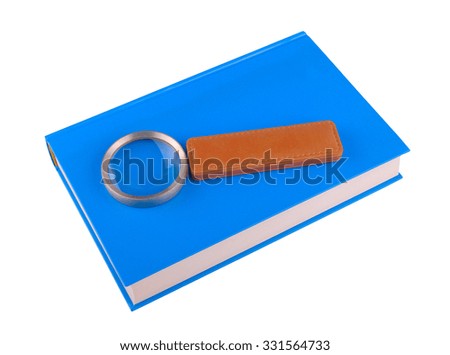 Magnifying glass lying on the book