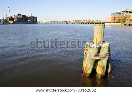 Wood pilings lashed together with steel cable, Inner Harbor, Baltimore, MD