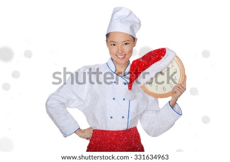 Asian chef with clock and Christmas hat in falling snow