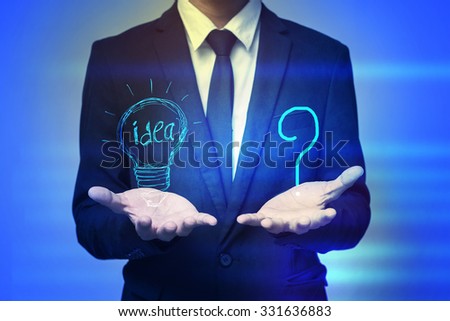 Close up of businessman holding idea in palms