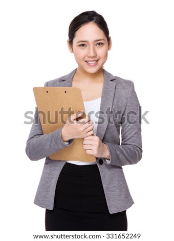Young businesswoman hold with clipboard