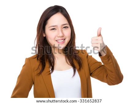 Young Buisnesswoman showing thumb up