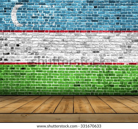 Uzbekistan flag painted on brick wall with wooden floor
