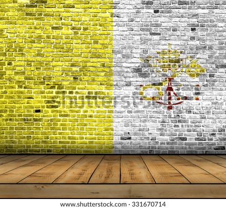 Vatican City flag painted on brick wall with wooden floor