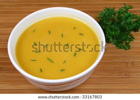 Pumpkin soup on wooden background. Polish cuisine.