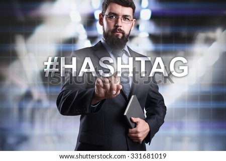 Businessman pressing button on touch screen interface and select #Hashtag. Business concept. Internet concept.