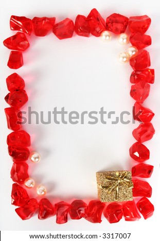 red ice stones, pearls and present frame  holiday background