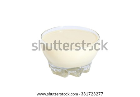  condensed milk with sugar in glass bowl isolated on white Royalty-Free Stock Photo #331723277