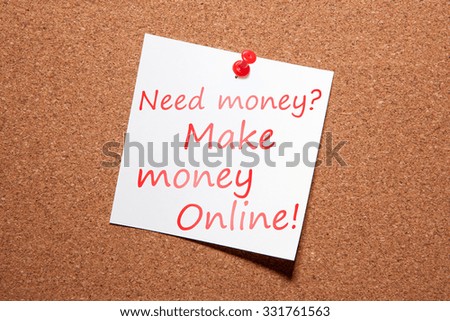 White sticker on the pin up board. Written in red marker "Need money? Make money Online!"