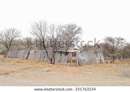 Shacks near the confluence of the Gariep (Orange) and Vaal Rivers near Douglas in the Northern Cape Province of South Africa Royalty-Free Stock Photo #331763234
