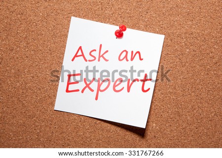 White sticker on the pin up board. Written in red marker "Ask an Expert"