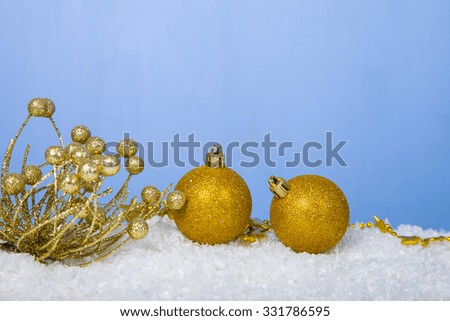 Christmas decorations in the snow on a blue background