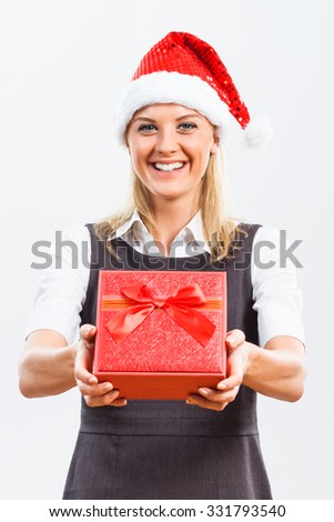 Beautiful business woman is holding Christmas gift.Christmas gift from business woman