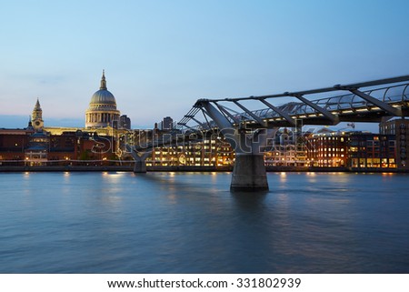 St Paul's Cathedral and Millennium bridge in London in the evening, natural colors