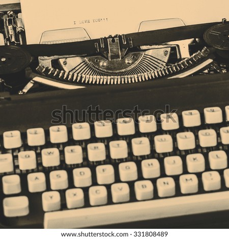 paper in typewriter with I Love You!!! as a text
