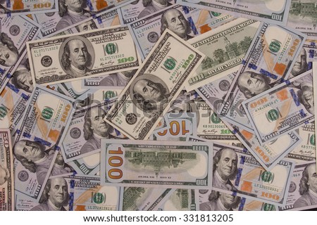 One hundred US dollars. Many banknotes. Benjamin Franklin, Independence Hall.
