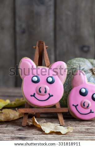 Homemade gingerbread cookie - three little piggies on the wooden table. Space for text and selective focus.