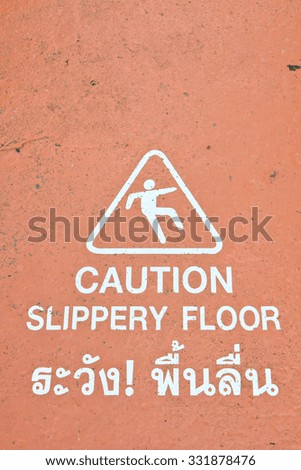 Caution sign information on the orange floor