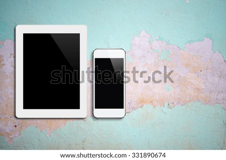 Tablet,Smartphone on cement floor ,Cracked paint ,peeling paint background with copy space and text space