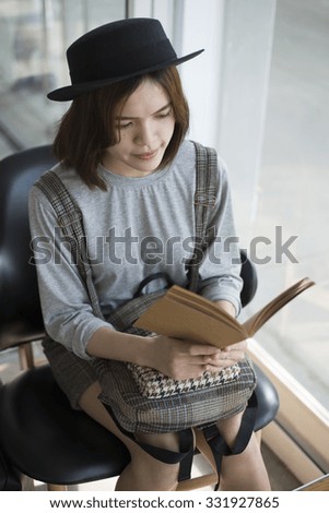 Pretty girl read a book. portrait young woman in vintage style