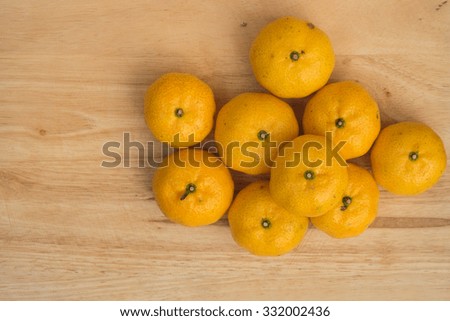tangerine orange on wood