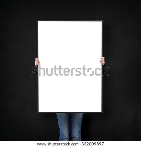 woman with blank poster on wall background